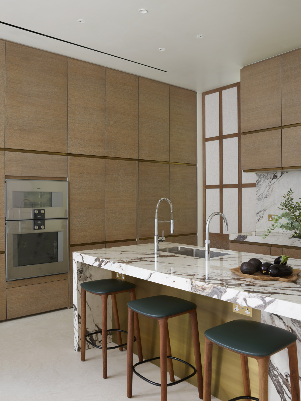 The kitchen area on the basement level of a Kensington, London home designed by Boundary Space