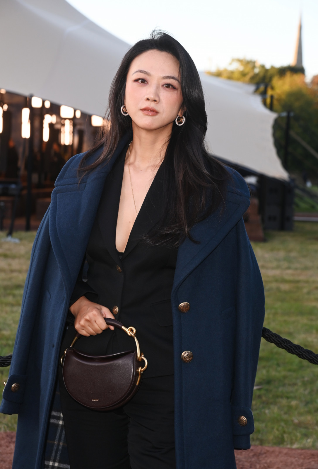 LONDON, ENGLAND - SEPTEMBER 22: Tang Wei arrives at the Burberry Summer 2026 show during London Fashion Week on September 22, 2025 in London, England. 

Photo by Dave Benett