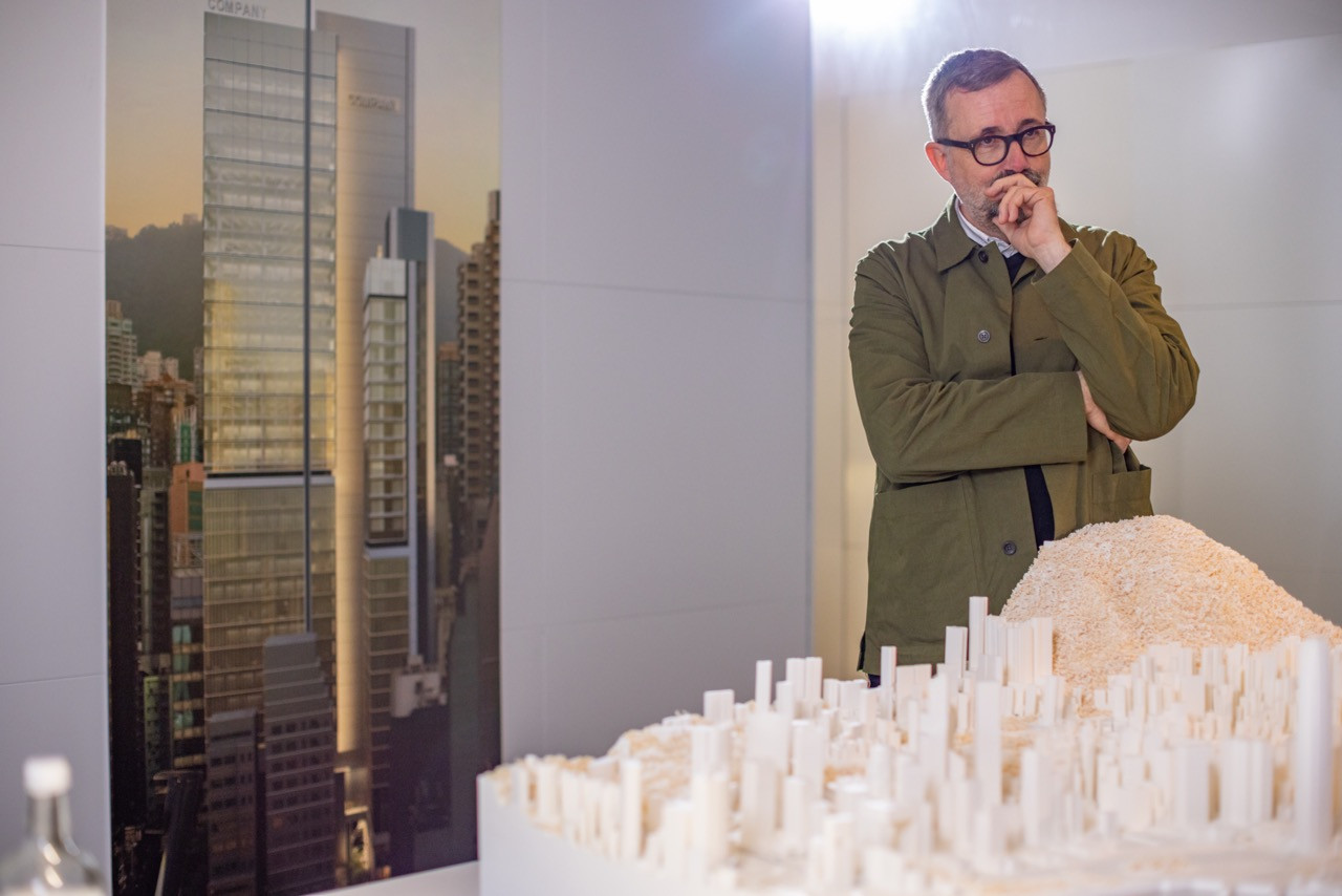 Michael Jones, Senior Partner at Foster + Partners, reviews the Central Crossing development model at the firm’s offices. The Yorkshire-born architect leads his first project in Hong Kong, integrating heritage preservation with contemporary design.