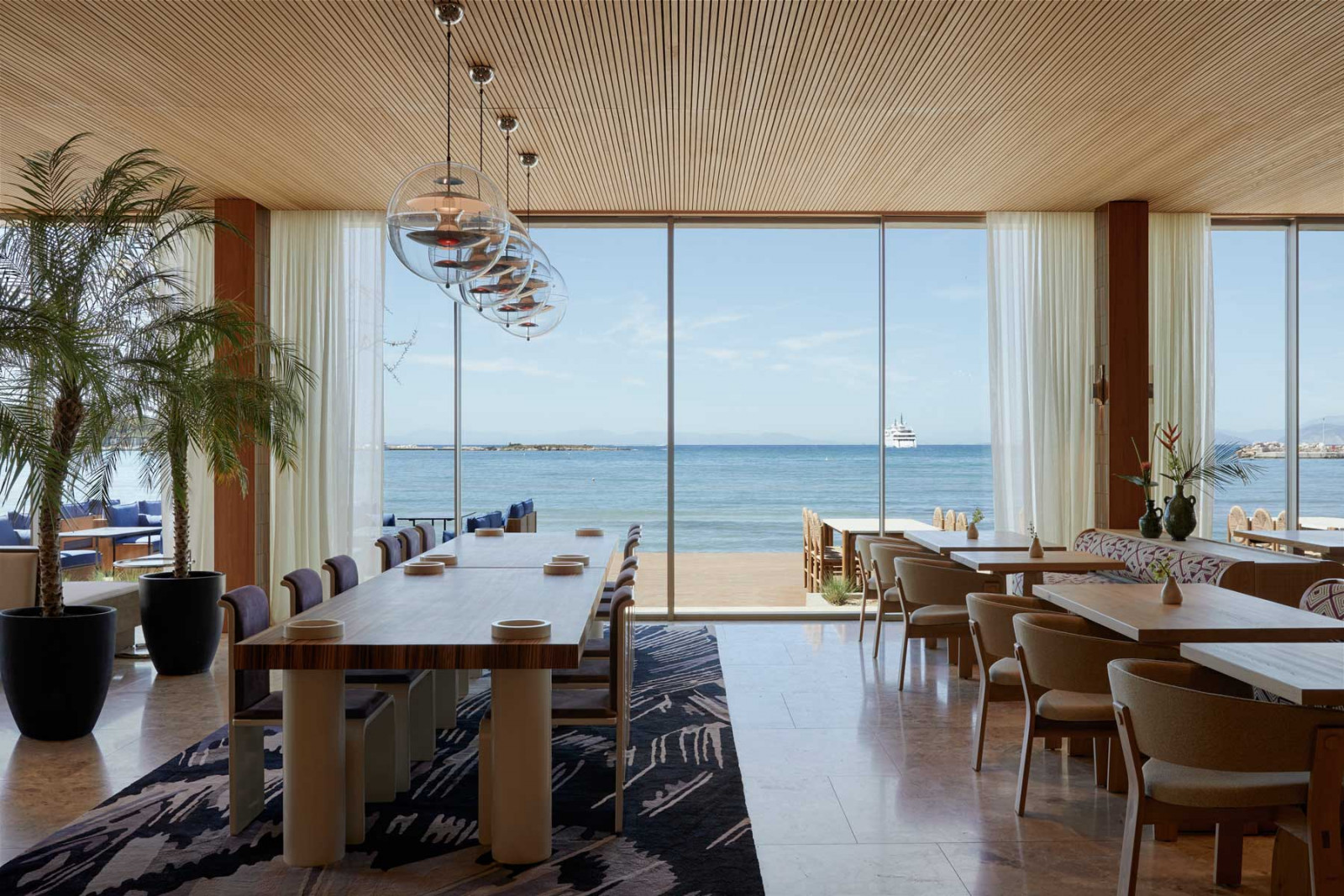 Its design aesthetic is rooted in mid-century elegance, while its menu blends Mediterranean ingredients with Asian techniques (Photo: Bungalow 7)