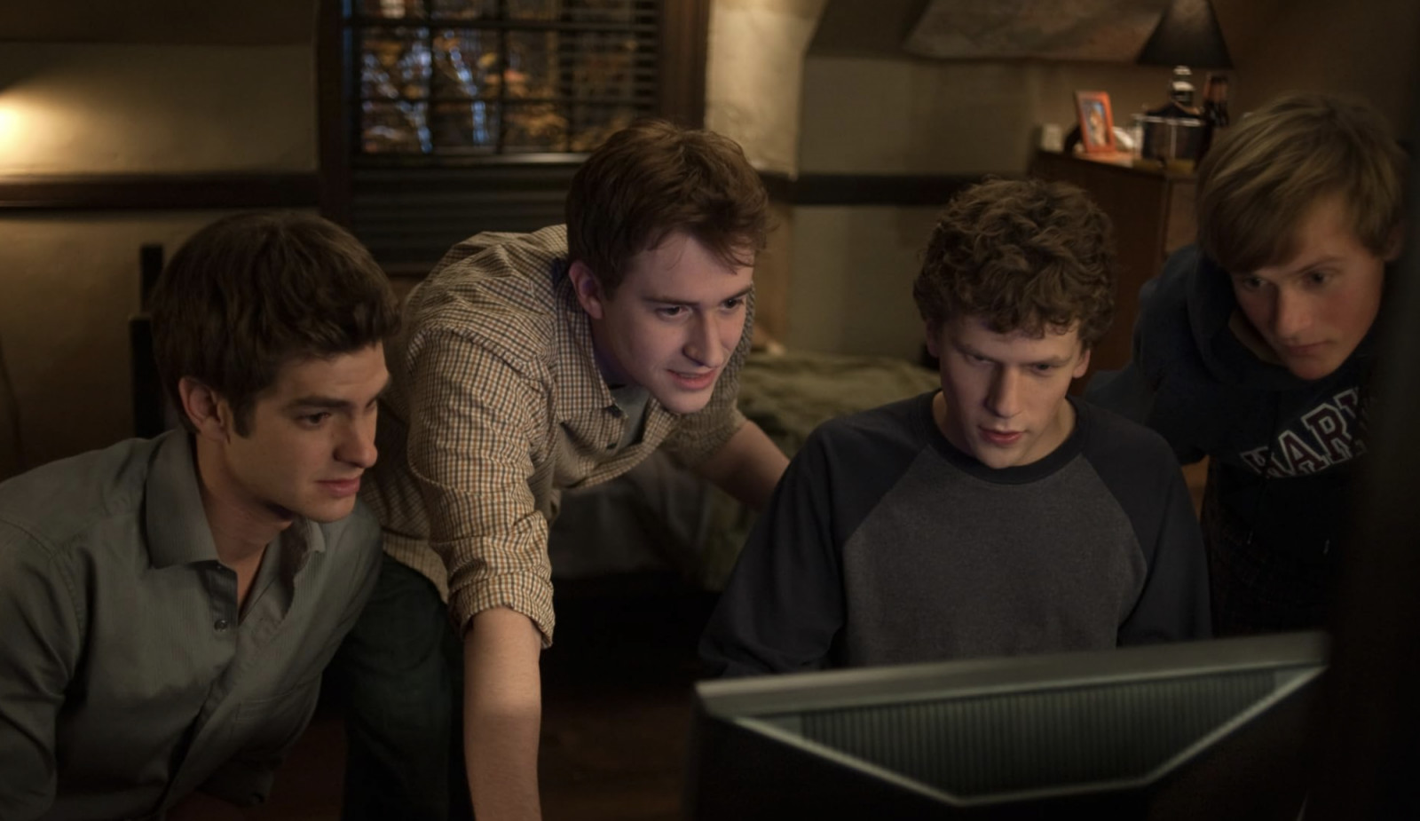 Joseph Mazzello, Jesse Eisenberg, Andrew Garfield, and Patrick Mapel in The Social Network (Photo: IMDB)