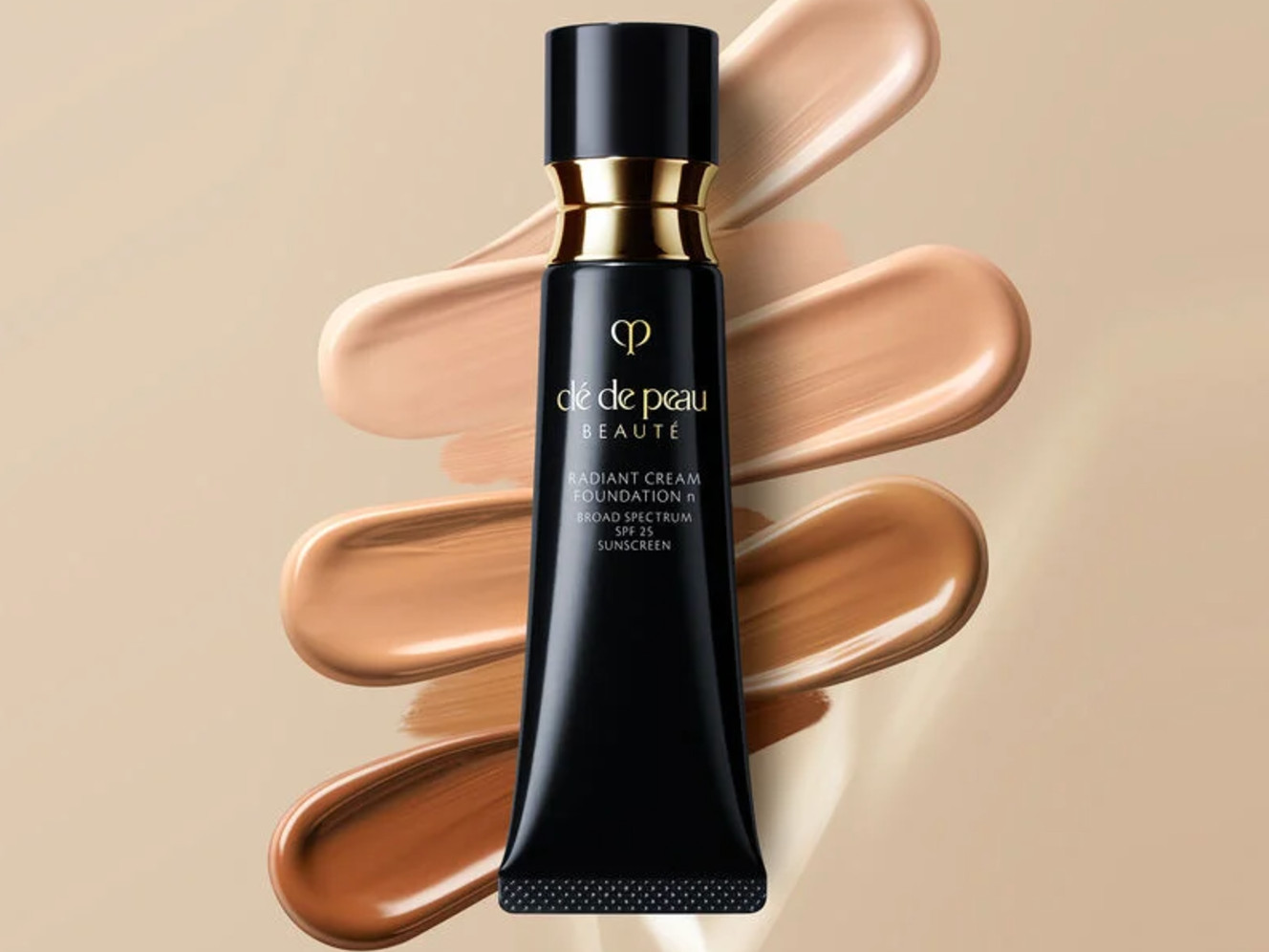 A luxurious cream foundation that provides the radiant finish of a skin tint with light-to-medium coverage. The formula feels comfortable and hydrating, blurring imperfections while giving the skin a luminous, flawless glow. It is designed to resist dullness and creasing, making it an excellent choice for a polished look in warm weather.