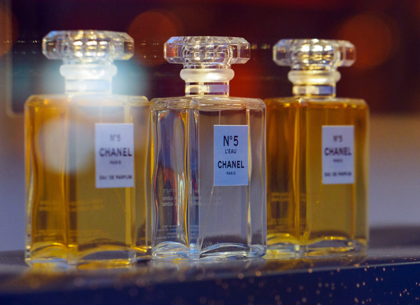 17 January 2021, Berlin: Three bottles with "Chanel No. 5 Paris" printed on them stand on a shelf in the window of a perfumery. Photo: Soeren Stache/dpa-Zentralbild/ZB (Photo by Soeren Stache/picture alliance via Getty Images)