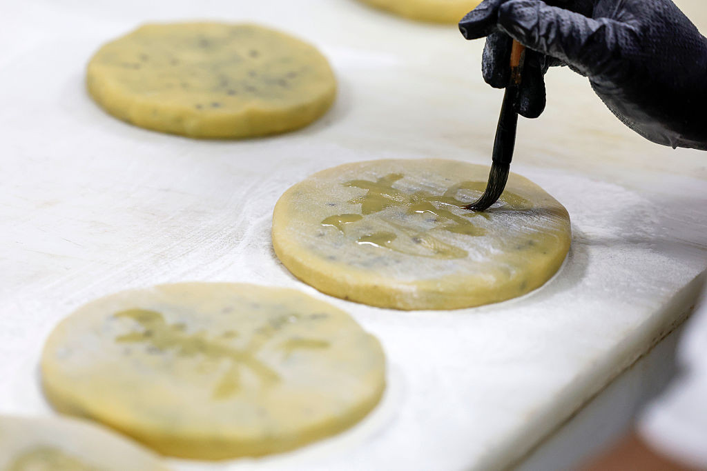 HUANGSHAN, CHINA - SEPTEMBER 18: A pastry worker makes Huizhou-style mooncakes in preparation for the upcoming Mid-Autumn Festival on September 18, 2025 in Huangshan City, Anhui Province of China. (Photo by Shi Yalei/VCG via Getty Images)