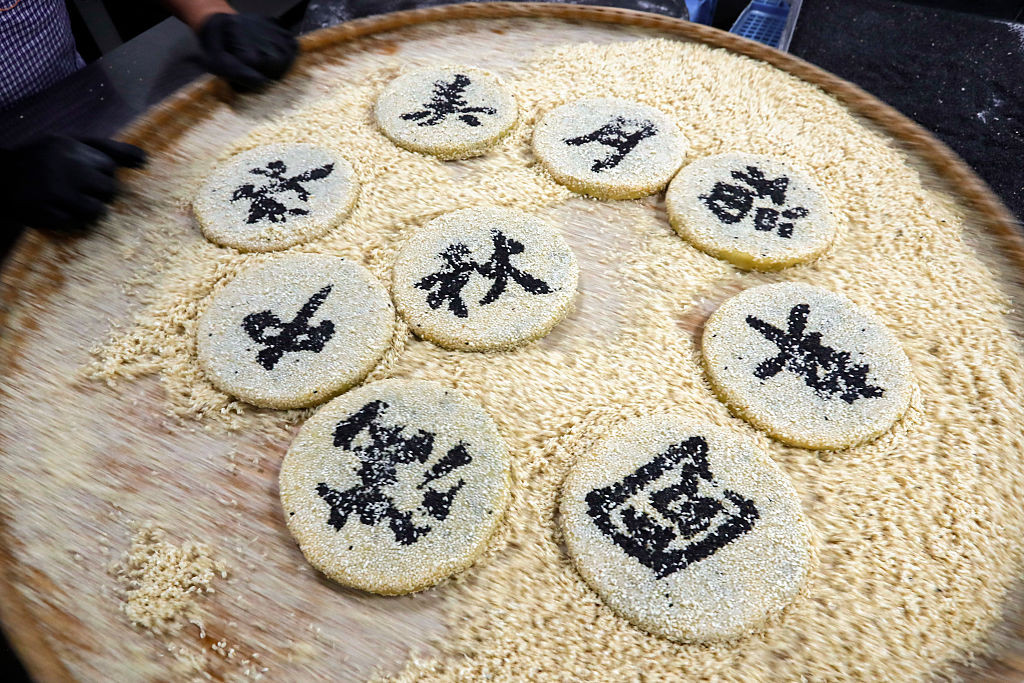 HUANGSHAN, CHINA - SEPTEMBER 18: A pastry worker makes Huizhou-style mooncakes in preparation for the upcoming Mid-Autumn Festival on September 18, 2025 in Huangshan City, Anhui Province of China. (Photo by Shi Yalei/VCG via Getty Images)