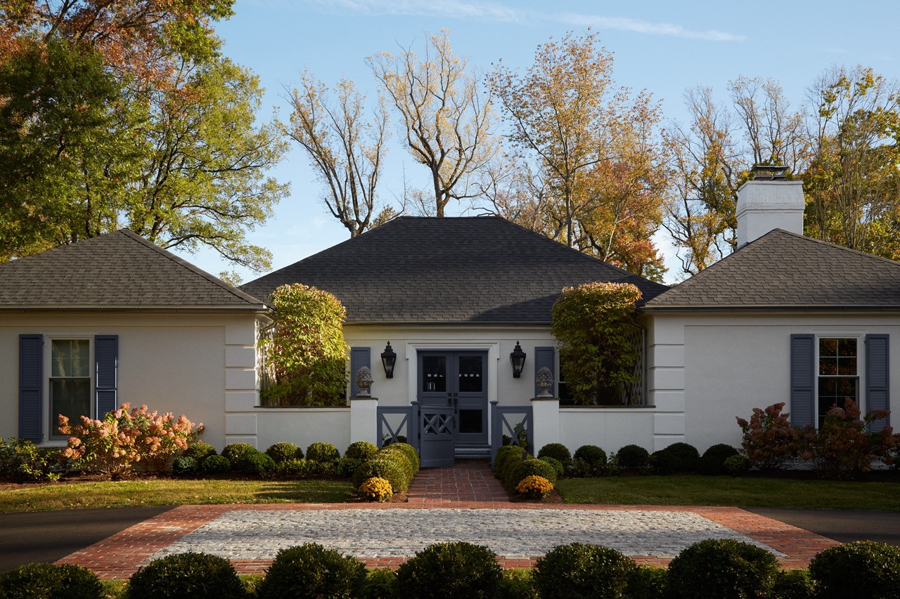 The 1974 French Colonial house exterior maintains its historic character whilst the interiors embrace contemporary colour choices