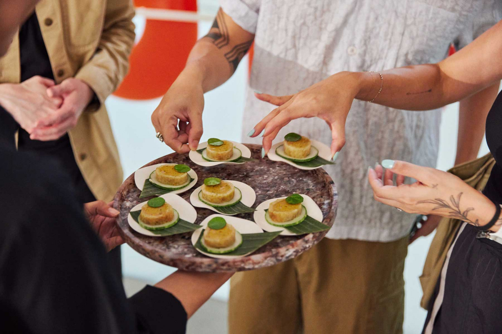 The Sausage of the Future visitors trying Marcus Tan’s otah-inspired Ocean Maw Dog (Photo: Finn Partners)