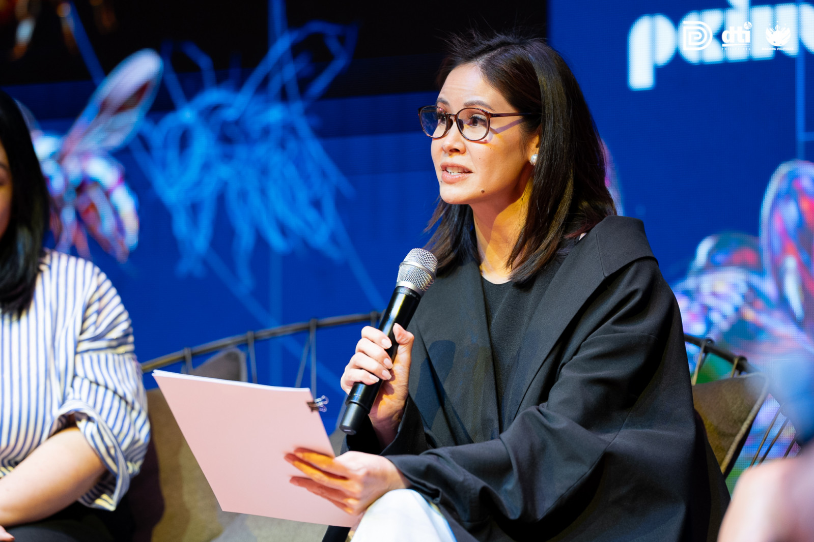 Marga Valdes speaking during a panel discussion at the DTI Design Center of the Philippines' ninth International Design Conference, entitled "Holding The Whole"