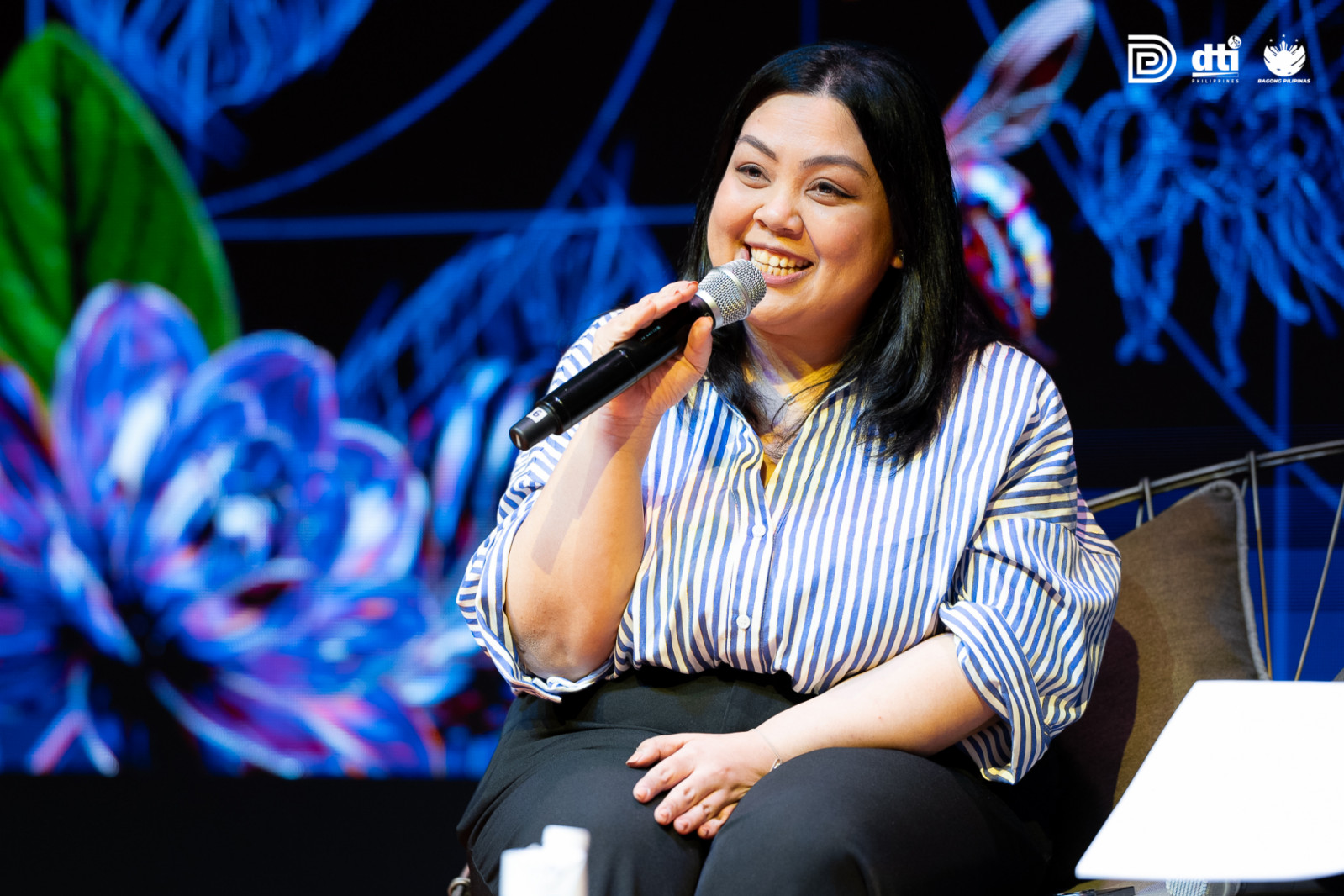 Maisie Littaua speaking during a panel discussion at the DTI Design Center of the Philippines' ninth International Design Conference, entitled "Holding The Whole"