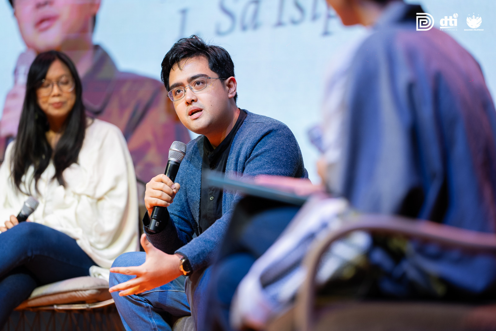 Carl Cervantes speaking during a panel discussion at the DTI Design Center of the Philippines' ninth International Design Conference, entitled "Holding The Whole"