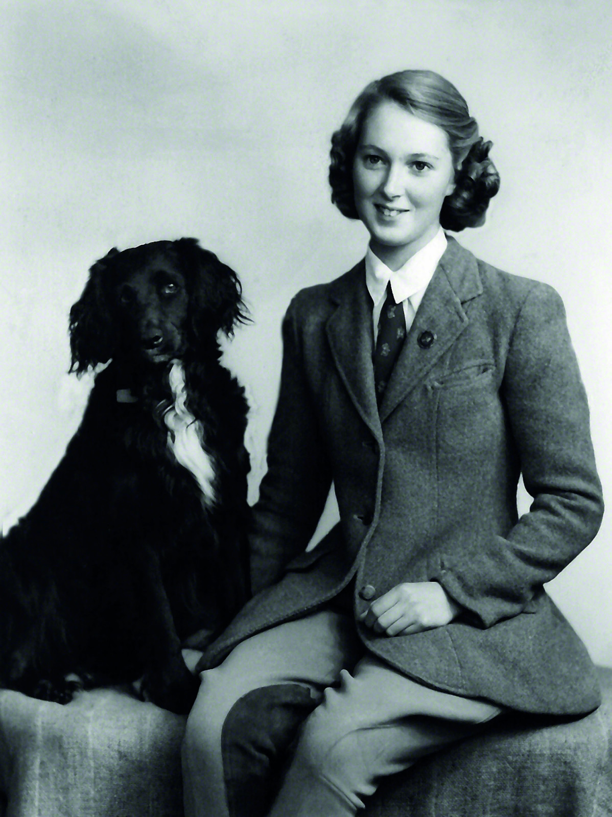Conservationist Jane Goodall in a studio portrait in 1954, with her dog Rusty