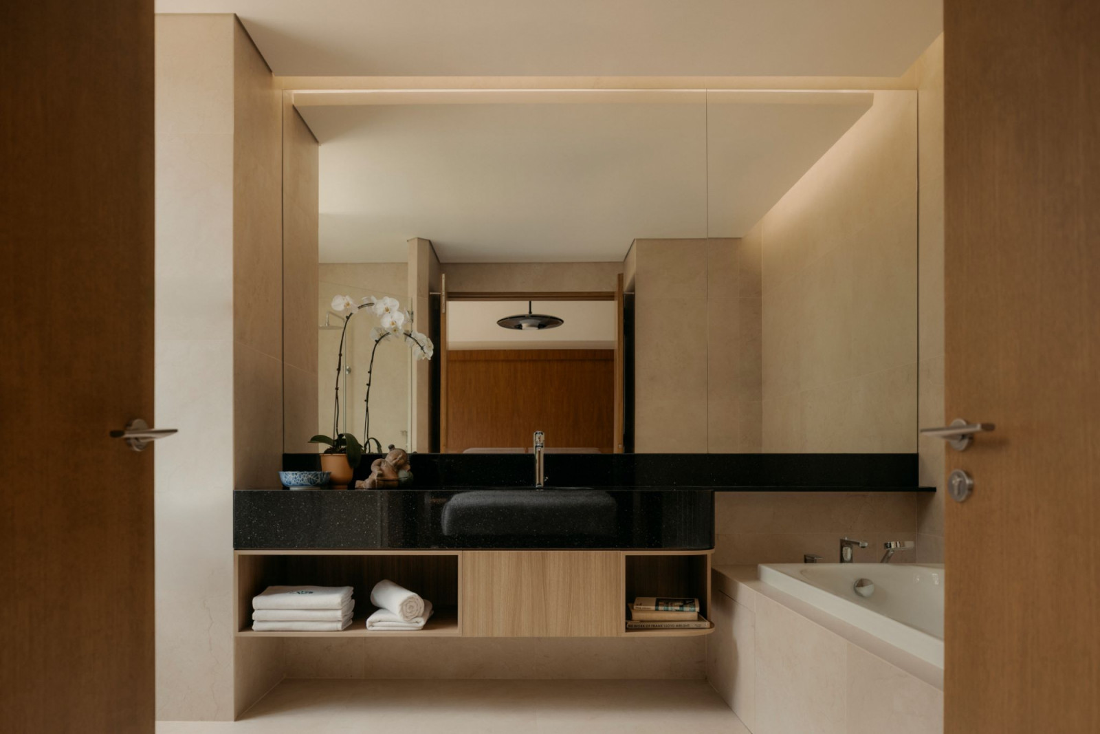 The bathroom is finished with the same resort-like sensibilities