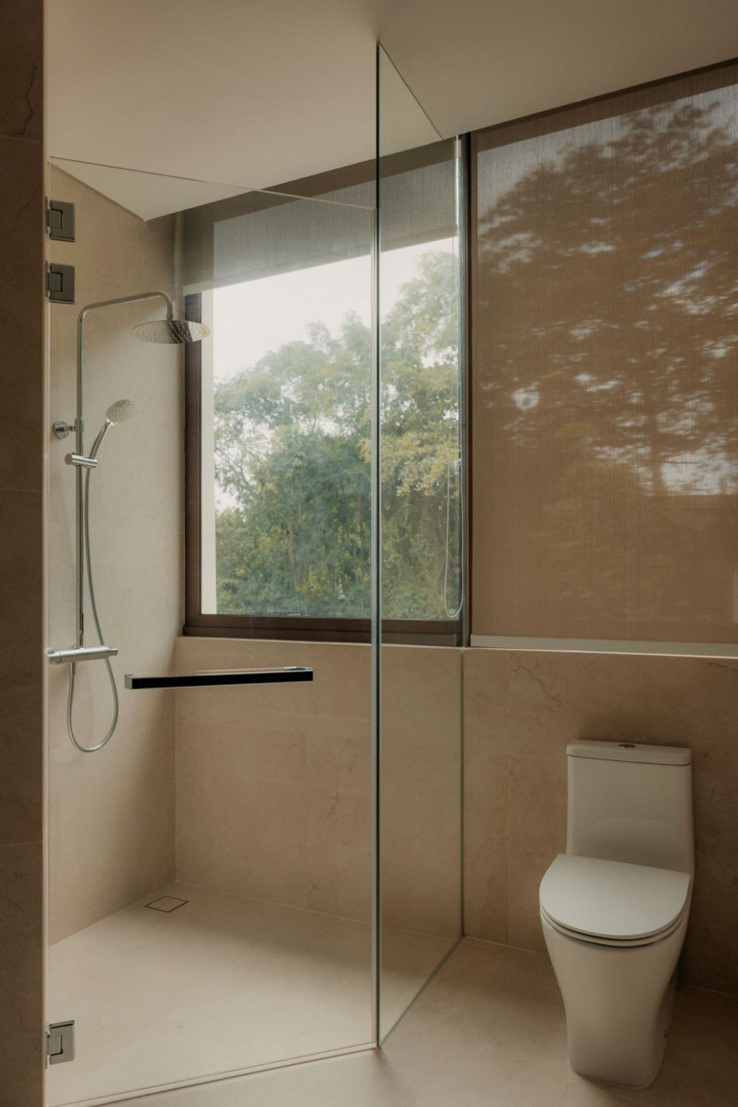 A picture window allows an experience akin to showering in nature