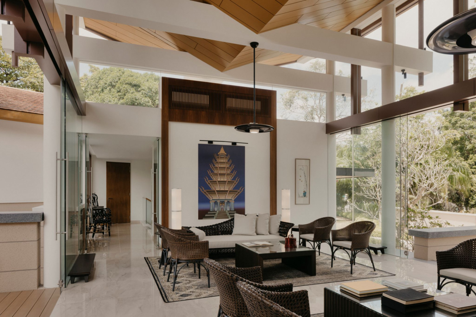 One of Ho Kwon Cjan’s “fantasy building” artworks in the living room depicts a tower with an inverted roof “because the people inside worship rain and whenever it rains, they would come inside and dance with the water pouring down on them,” he describes