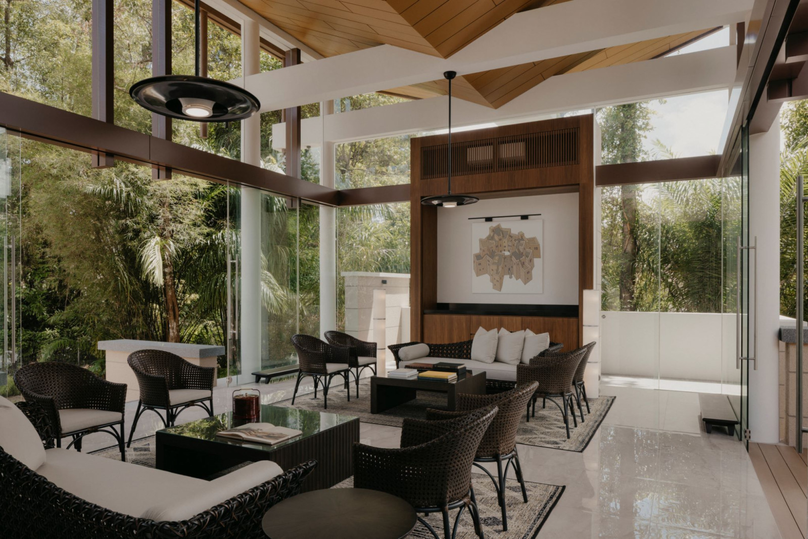 On the feature wall is an artwork of a fortress-like communal house built around a well, created by the homeowner himself, who names Dutch artist Johannes Vermeer as one of the many artists he admires