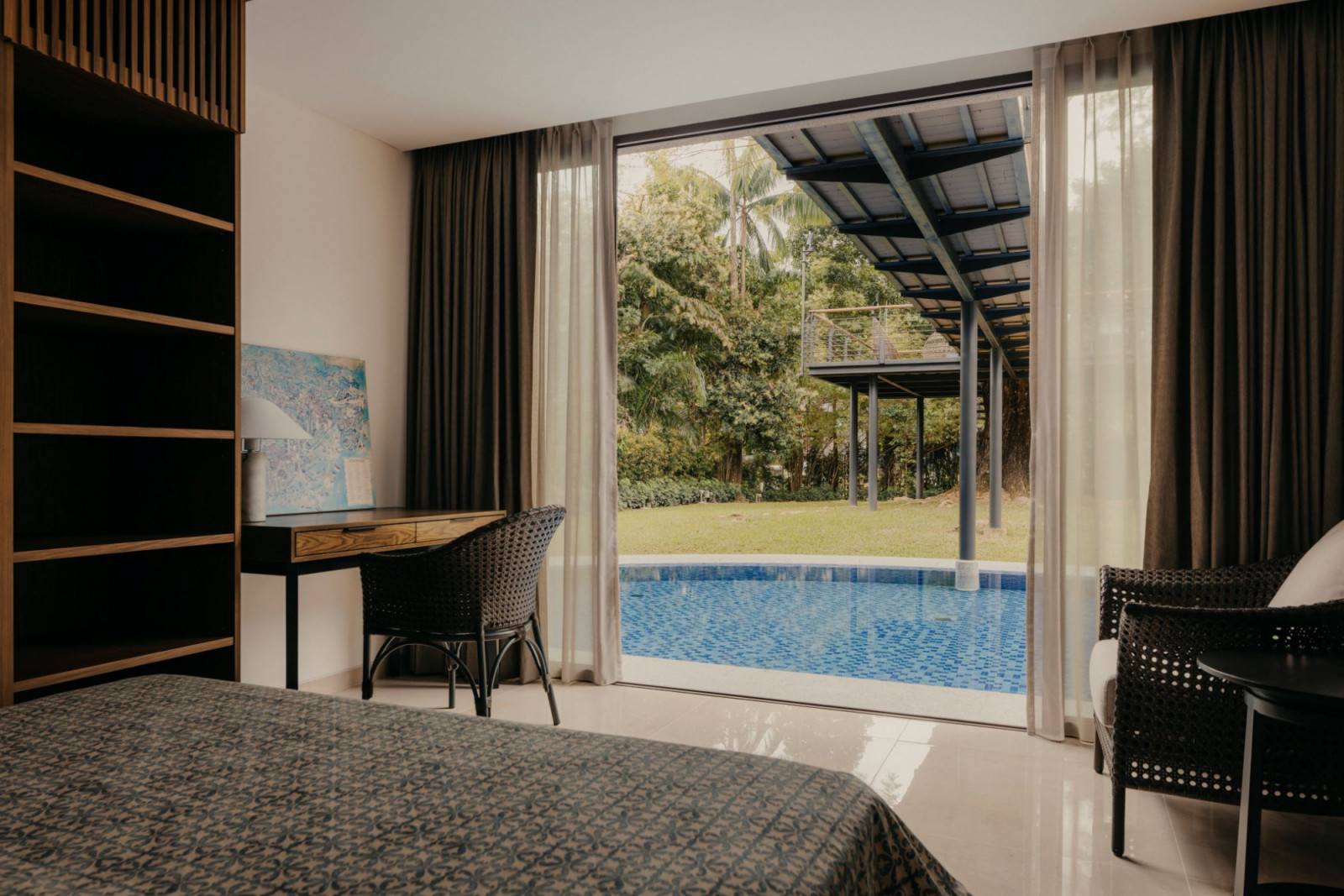 The pool and garden as viewed from a ground-floor bedroom