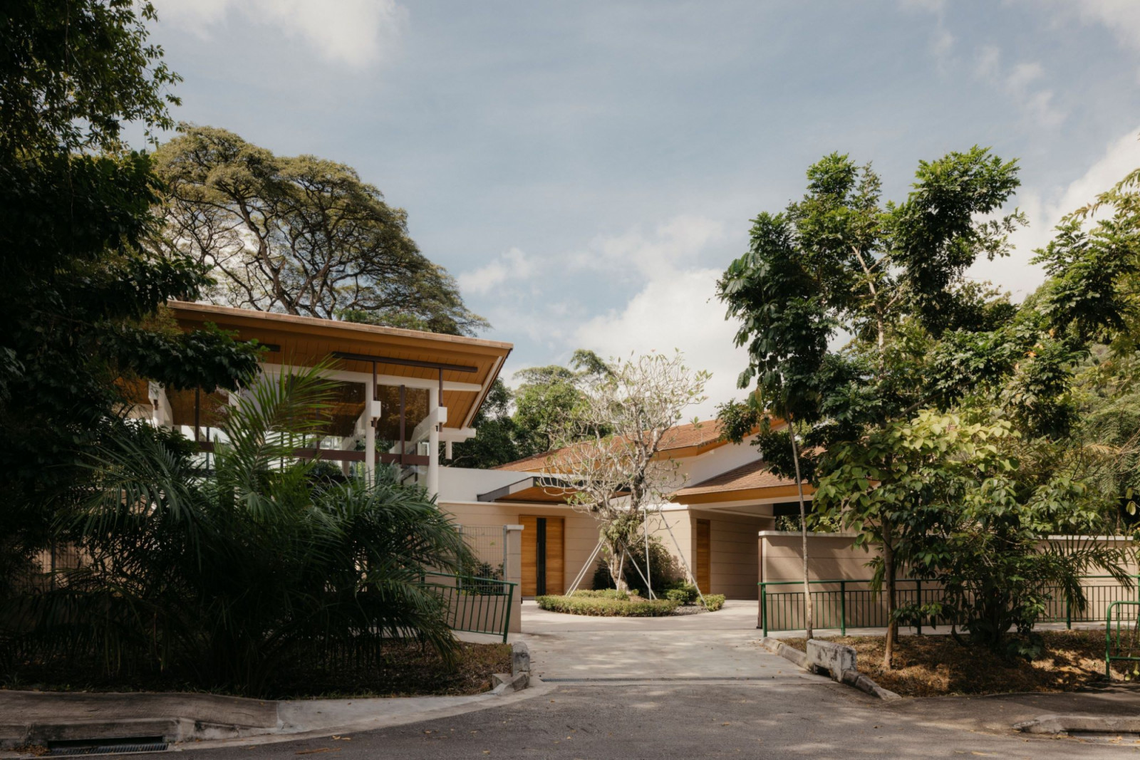 From the outside, the Good Class Bungalow appears as if hidden among the greenery