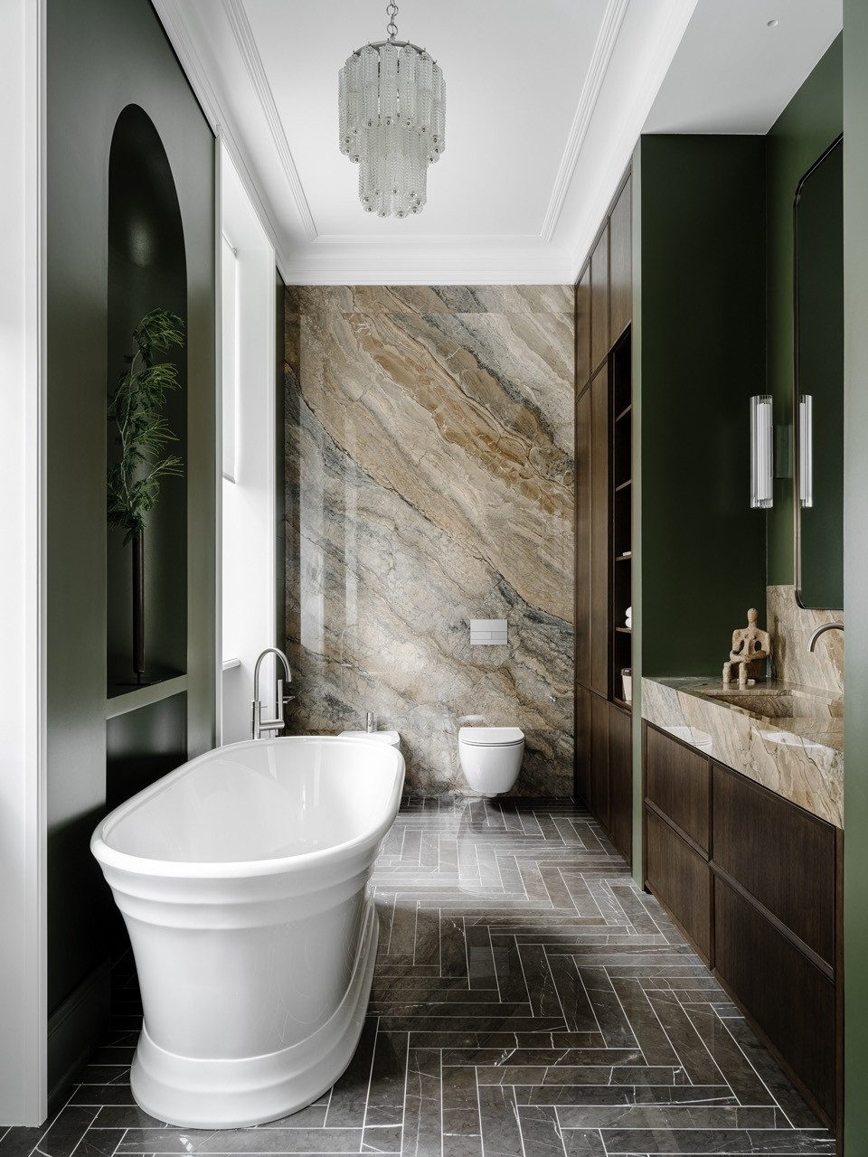 The master bathroom has two windows that flood the olive-green space with natural light