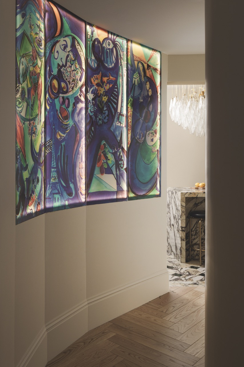 A statement artwork creates visual rhythm in the corridor