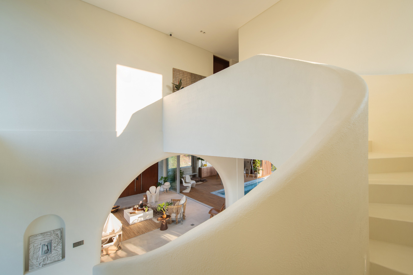The stairway leading up to the bedrooms of the Cove House by Brioarc Design Studio, located in Nasugbu, Batangas