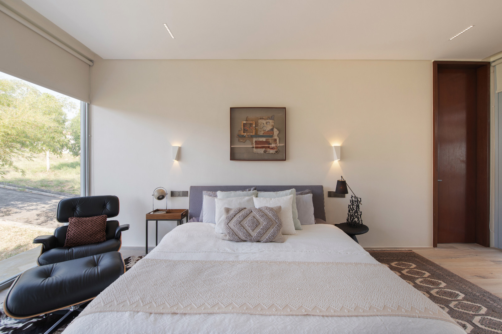The primary bedroom in the Cove House by Brioarc Design Studio, located in Nasugbu, Batangas