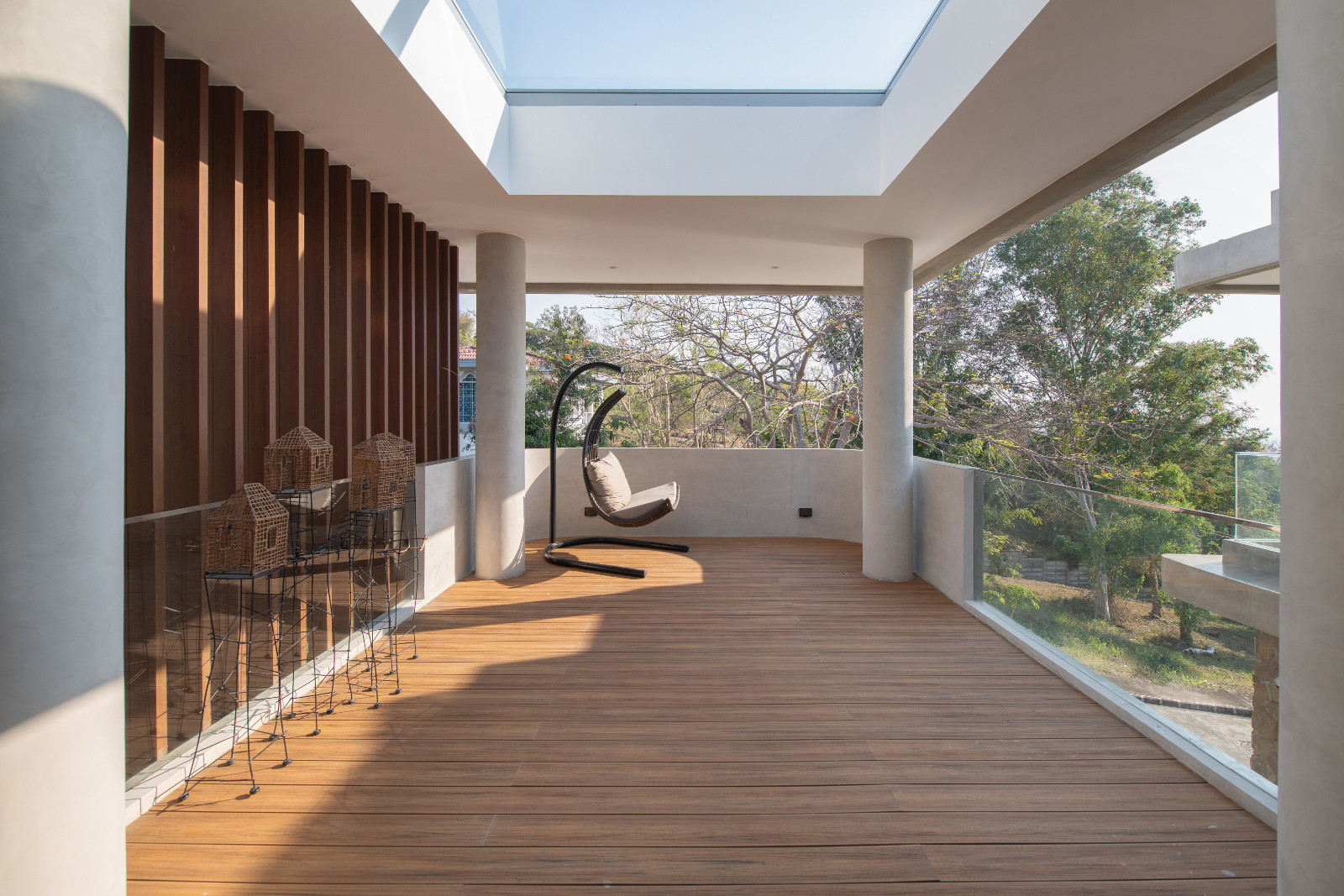 The outdoor deck beyond the primary bedroom of the Cove House by Brioarc Design Studio, located in Nasugbu, Batangas