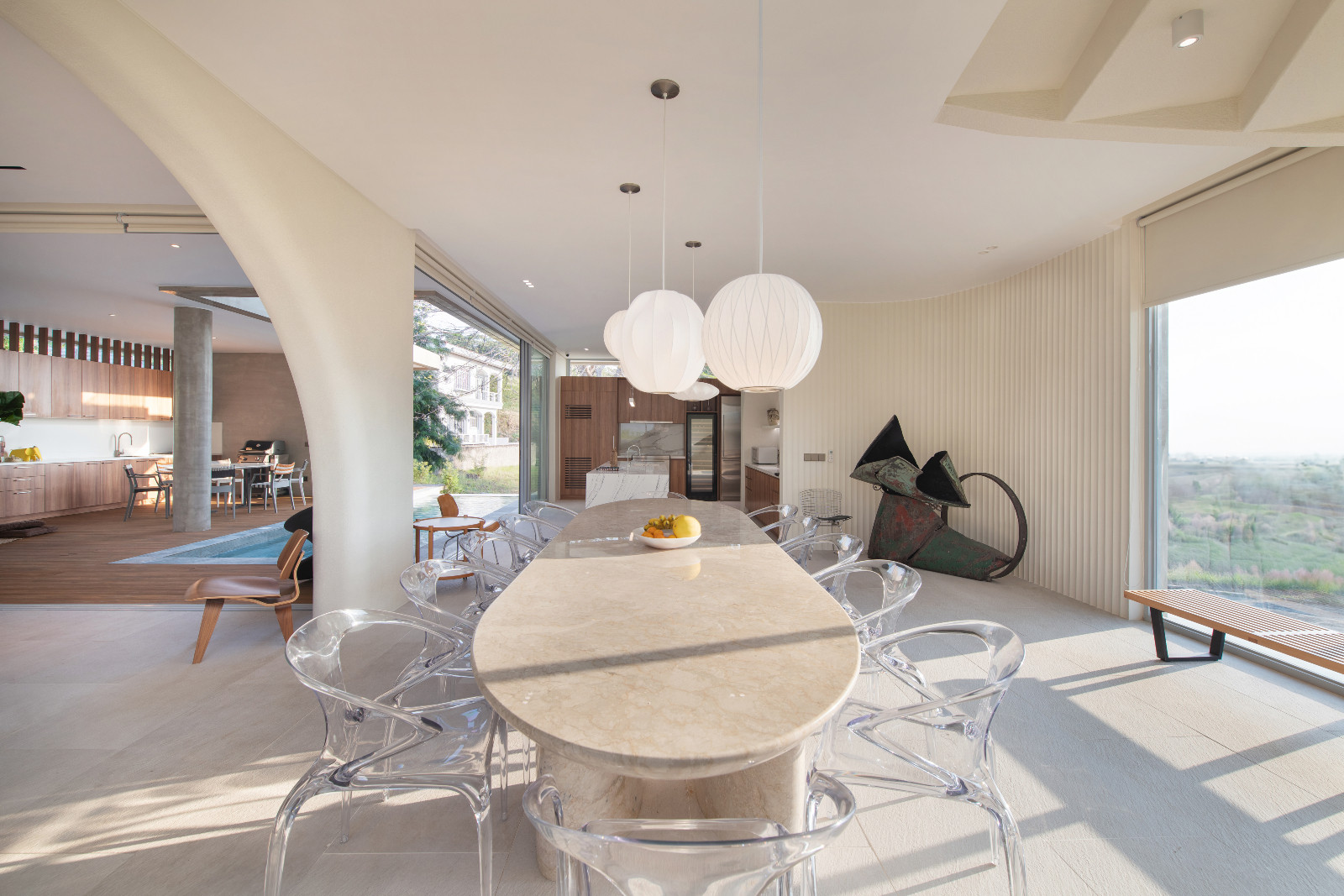 The dining room of the Cove House by Brioarc Design Studio, with a metal sculpture by Pete Jimenez. The site is located in Nasugbu, Batangas