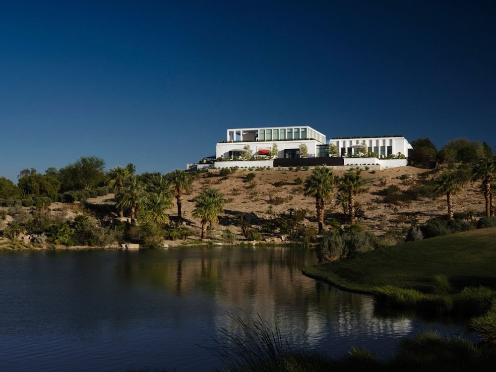 The grand architecture reveals itself amid the rugged terrain of the Nevada desert in a slow, cinematic unfurling