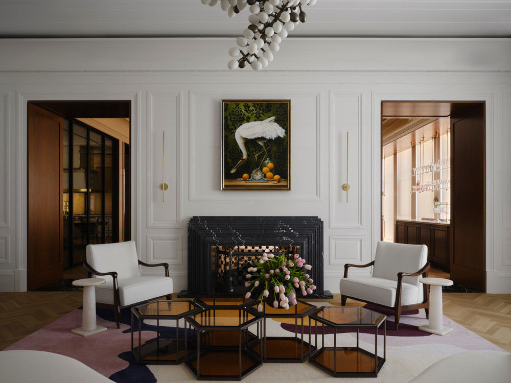 The whitewashed living room across from the main gallery