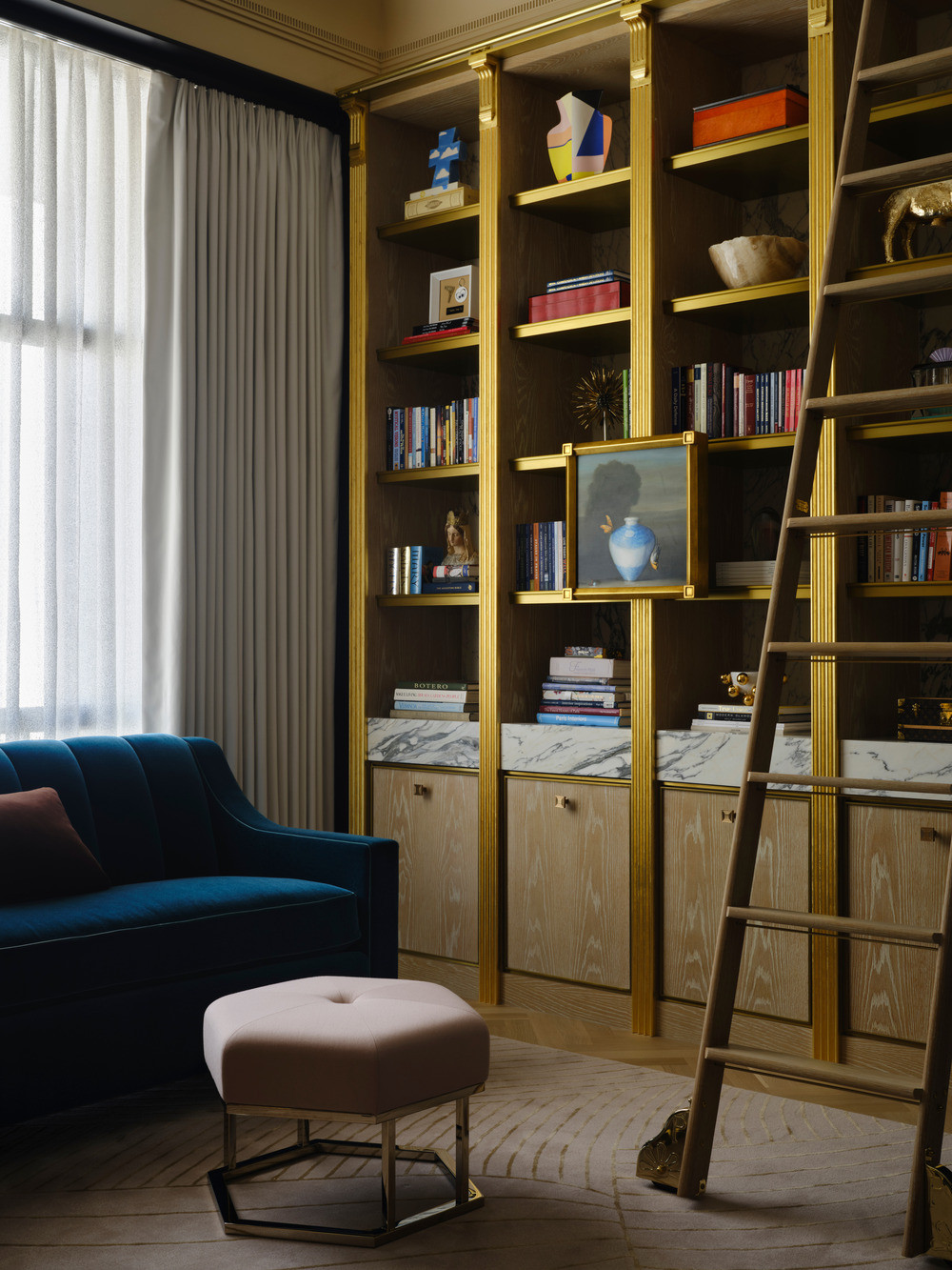 Cloaked in traditional refinement with stepped ceilings and gold-leaf-lined bookcases