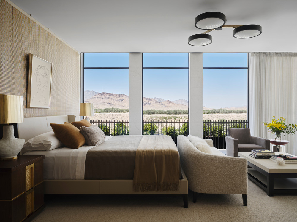 One of the bedrooms extends the interior’s warmth into the vast desert expanse