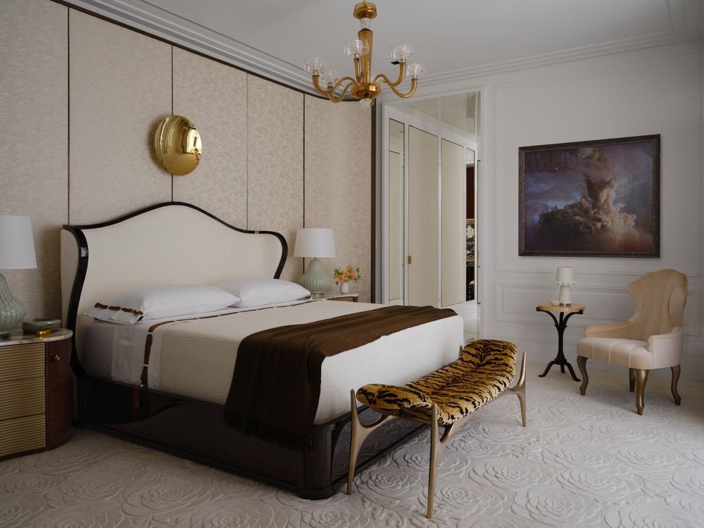The primary suite features rose petal-carved wool carpets underfoot, silk wall coverings, and a cocoon-like bed structure