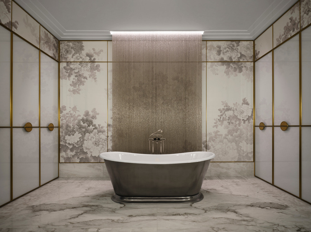 A freestanding tub framed by shimmering metal beads that glint like desert rain