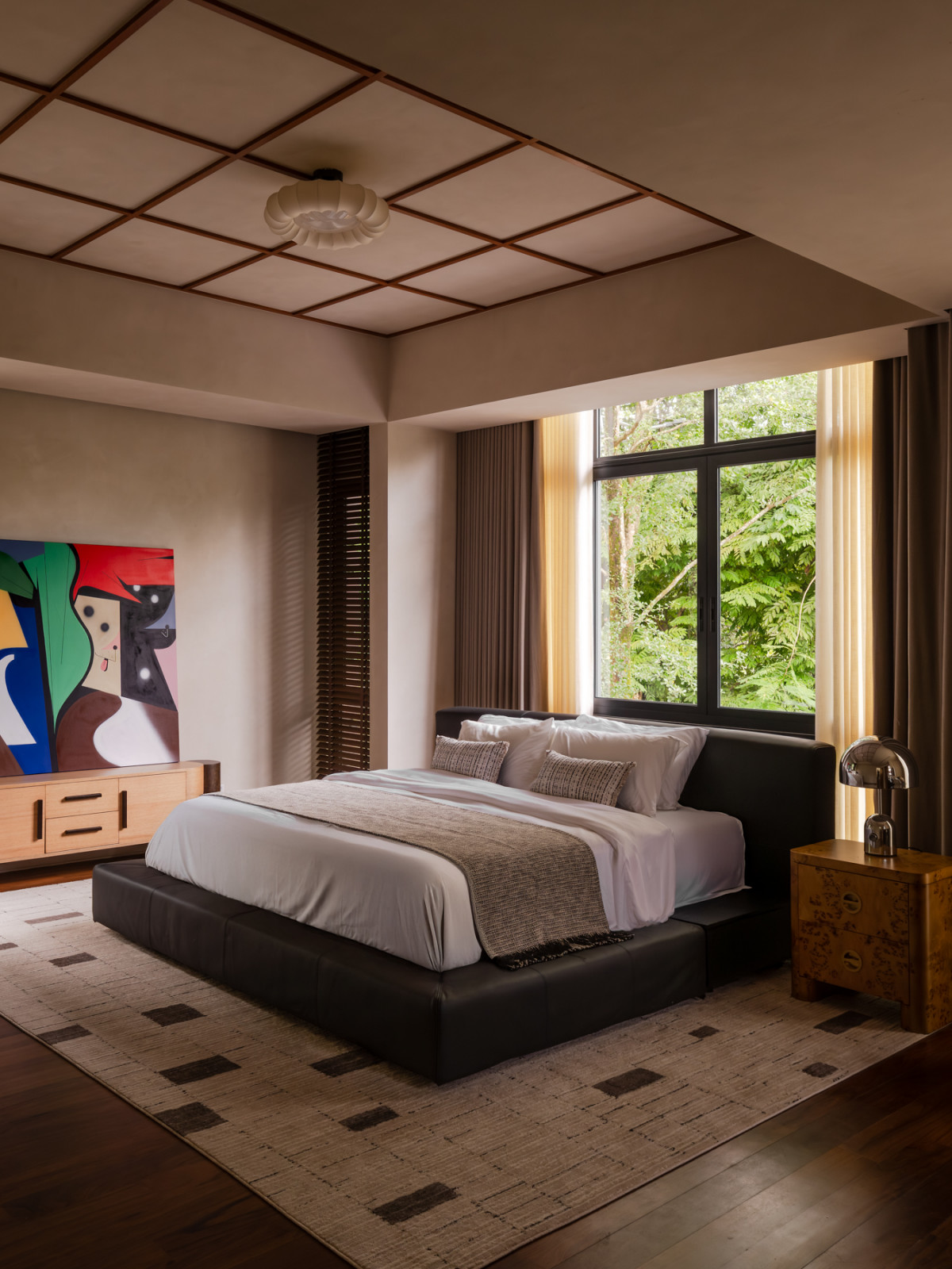 The master bedroom is “a space of quiet respite,” where the mobile bedhead accommodates annual adjustments according to shifting feng shui principles