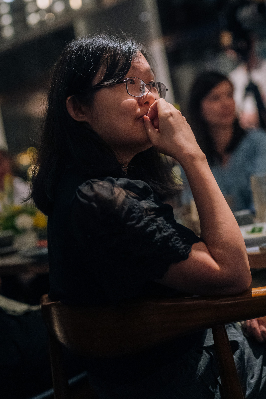 Florence Chan, co-founder and CEO of AI Guided, listens attentively to the speakers (Photo: Tatler Hong Kong)
