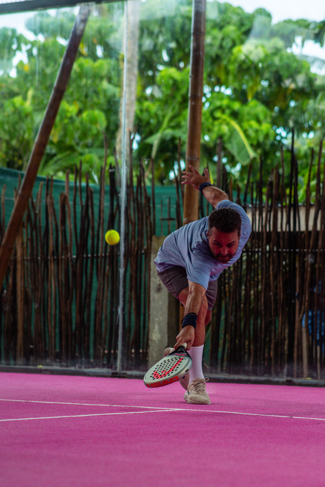 Locals playing padel on the pink court
