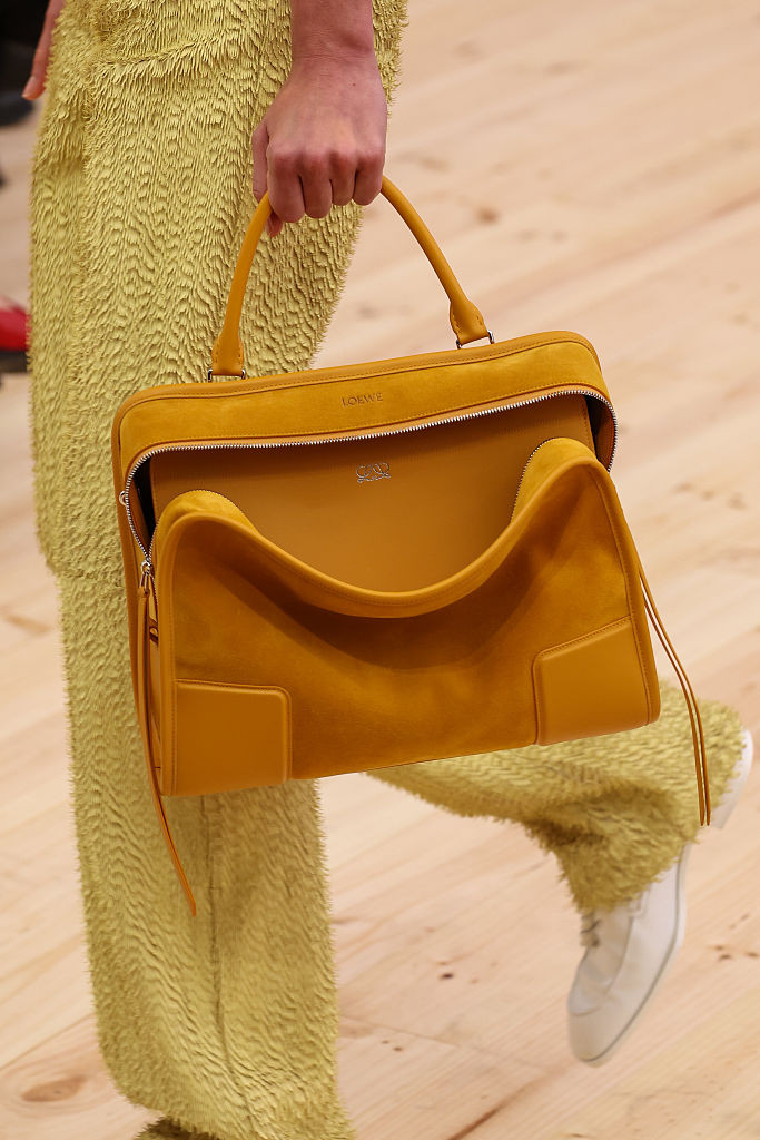 PARIS, FRANCE - OCTOBER 03: (EDITORIAL USE ONLY - For Non-Editorial use please seek approval from Fashion House) A model, bag detail, walks the runway during the Loewe Womenswear Spring/Summer 2026 show as part of Paris Fashion Week on October 03, 2025 in Paris, France. (Photo by Peter White/Getty Images)