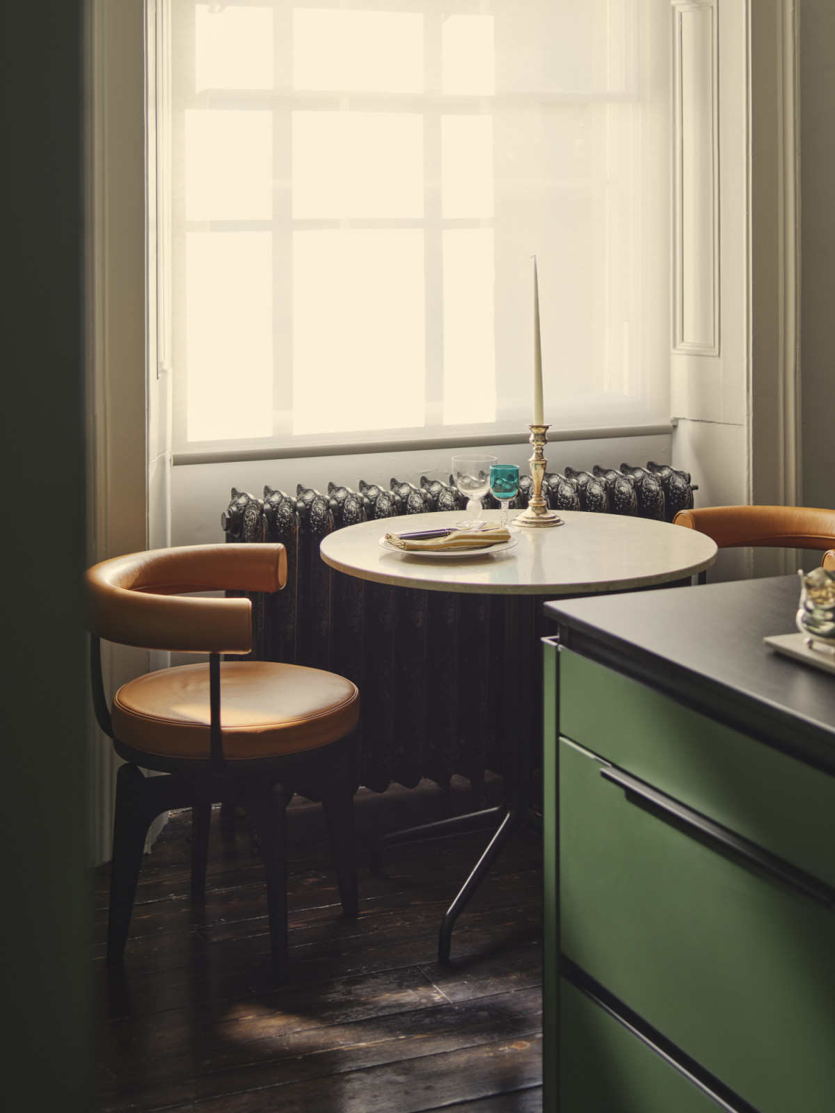 The bespoke kitchen by PJ Construction in a Dublin, Ireland home designed by Maison RA-D with a Long Lord Pendant light by RUBN, Indochine Chair by Cassina, Harbour Round Table by Audo CPH, Brick Candle Holders by 101CPH, and Rond Bowl by Audio CPH