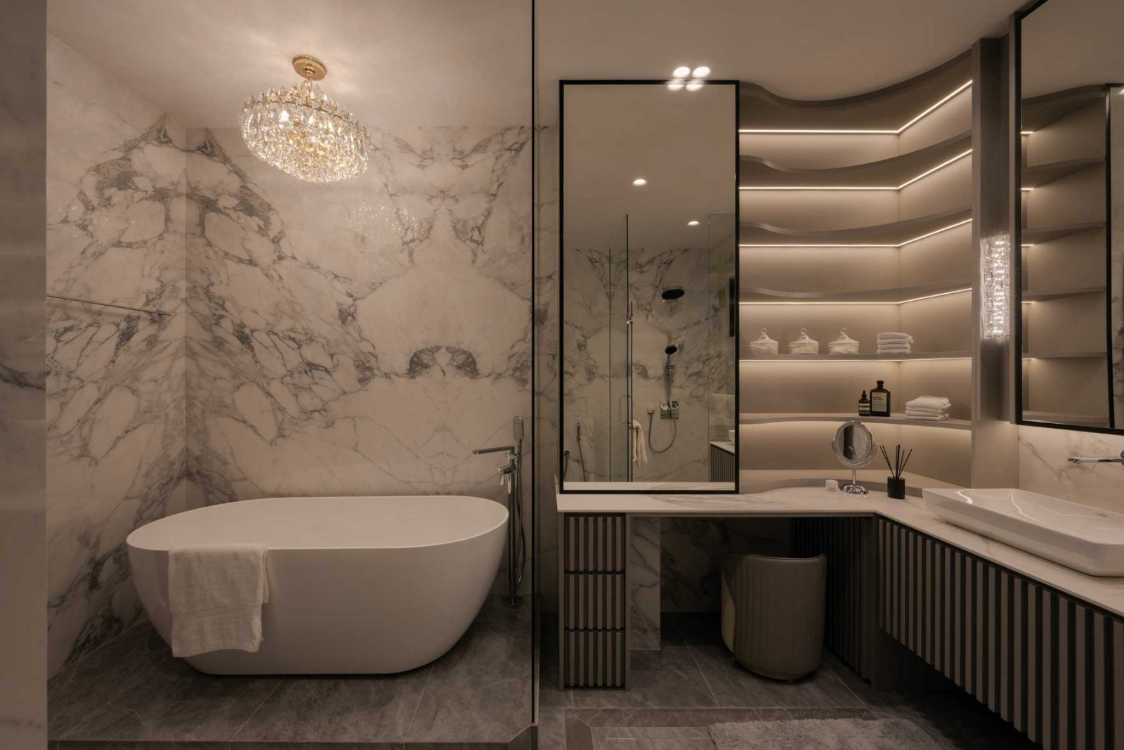 An opulent monochromatic palette, punctuated by black and white marble, extends into the master bathroom (Photo: Mr Shopper Studio)