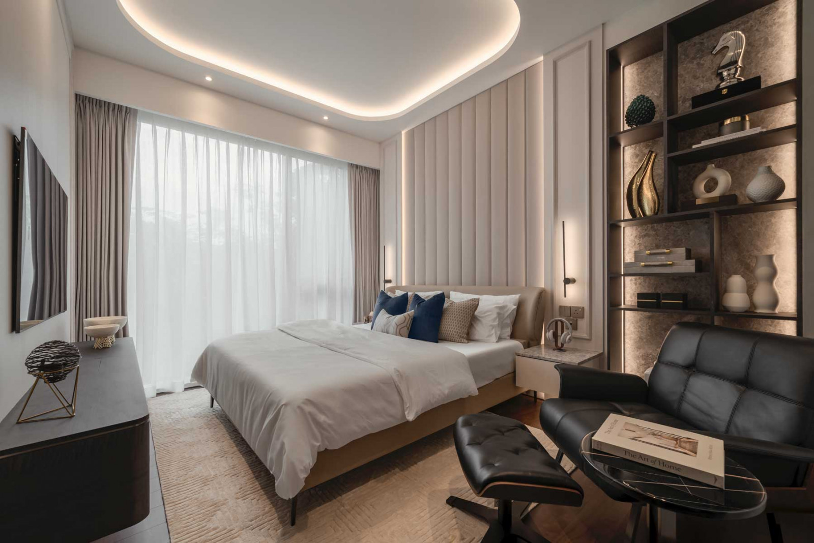 Vertical channels on the headboard cleverly mirror the drape of the curtains in the master suite (Photo: Summerhaus D’zign)