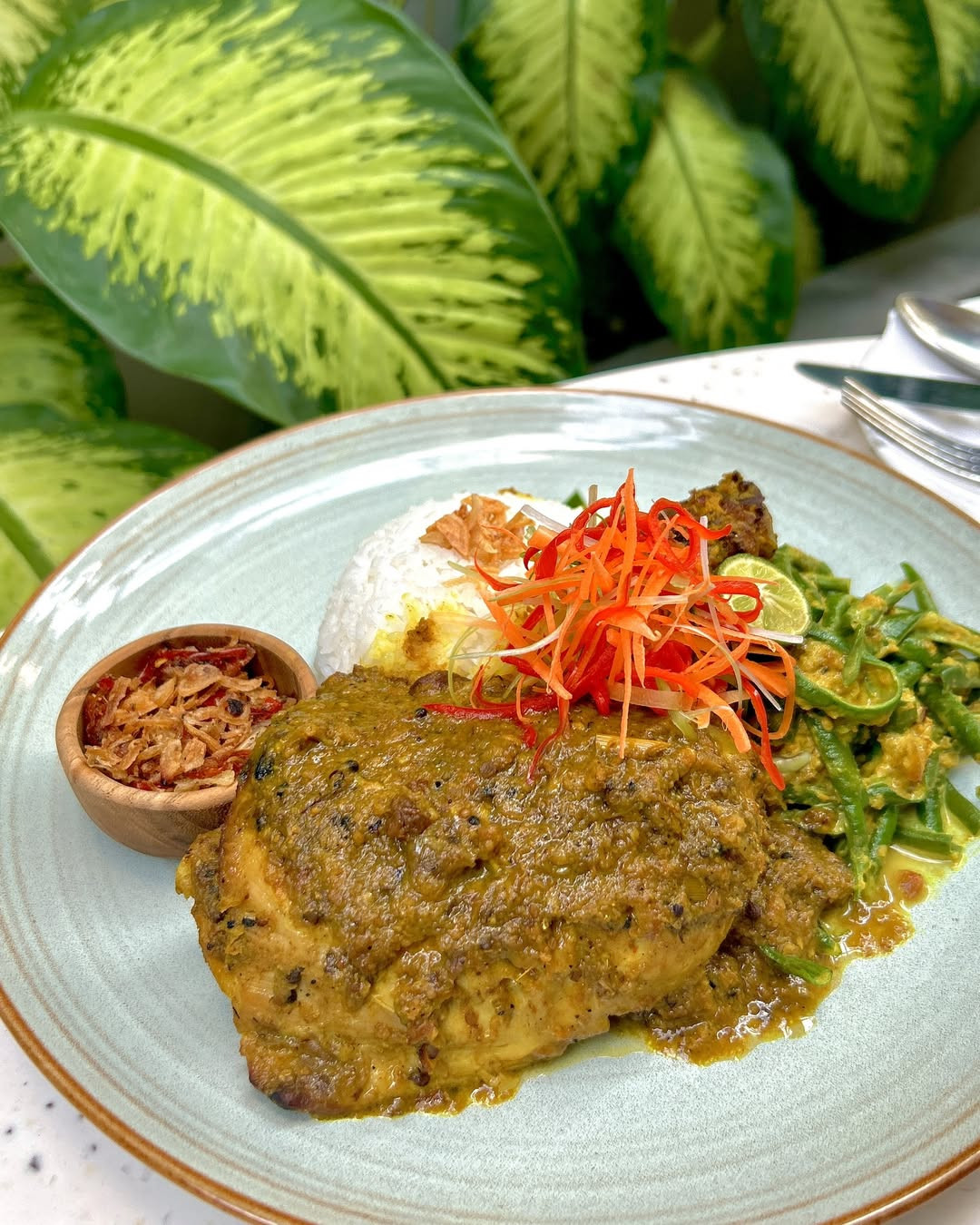 Ayam betutu is a smorgasboard of spices and textures to symbolise the cosmic order. (Photo: Instagram/@holidayinnbalisanur)