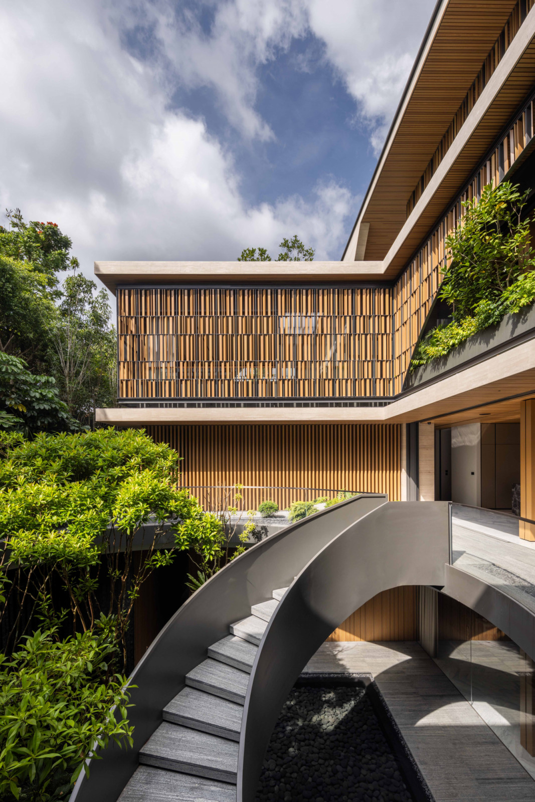 The good class bungalow appears to rise from incisions in the landscape, where architecture and nature intertwine seamlessly