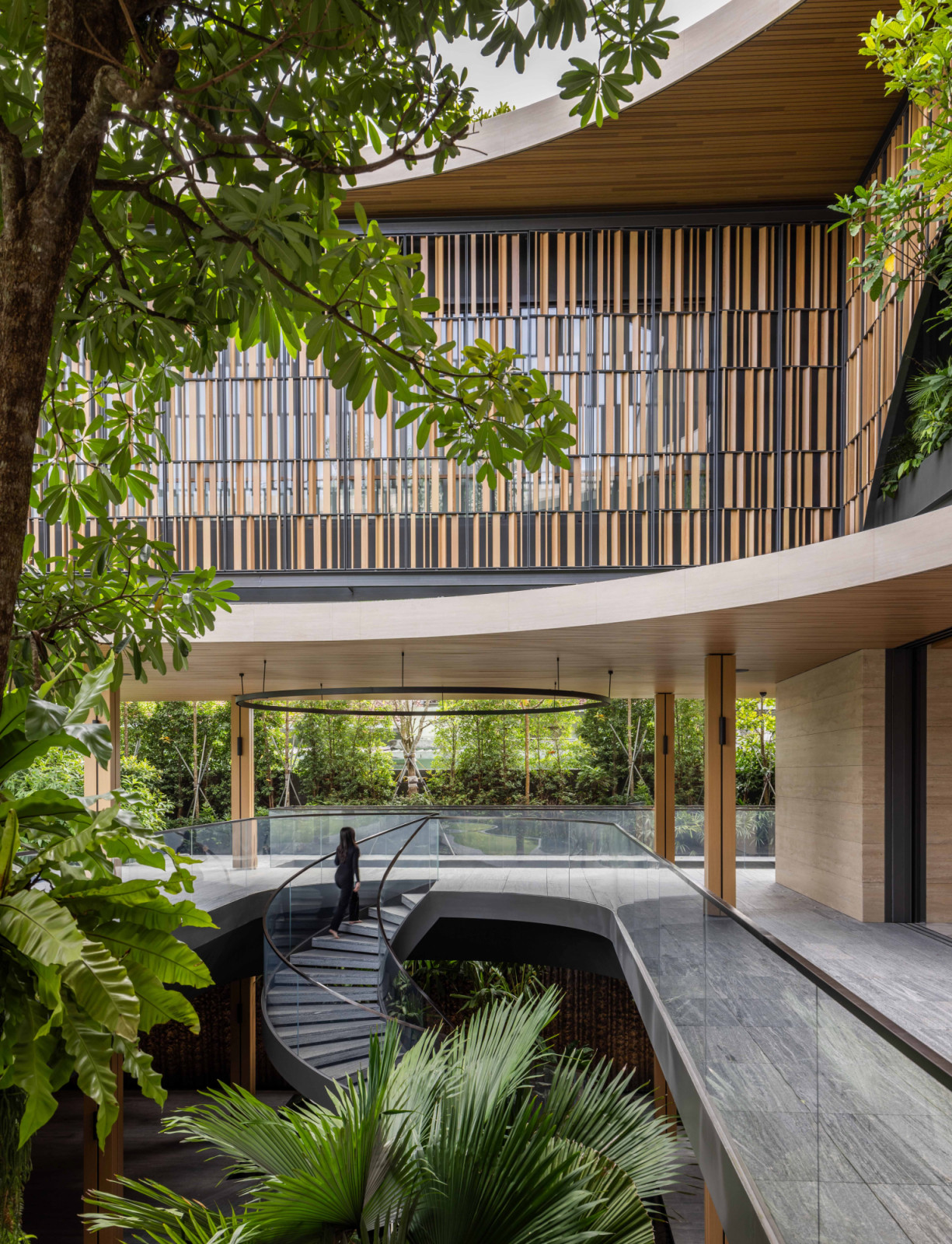 From above, the landscaped composition reveals a fluid connection between levels