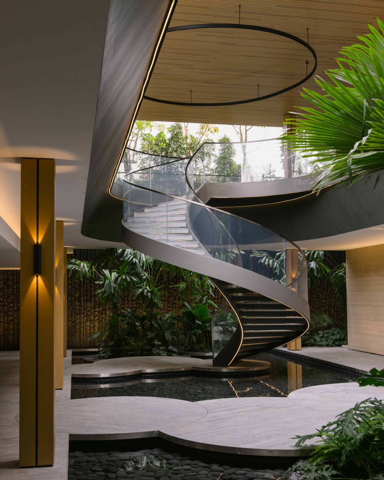 The sinuous spiral staircase winds dramatically upwards