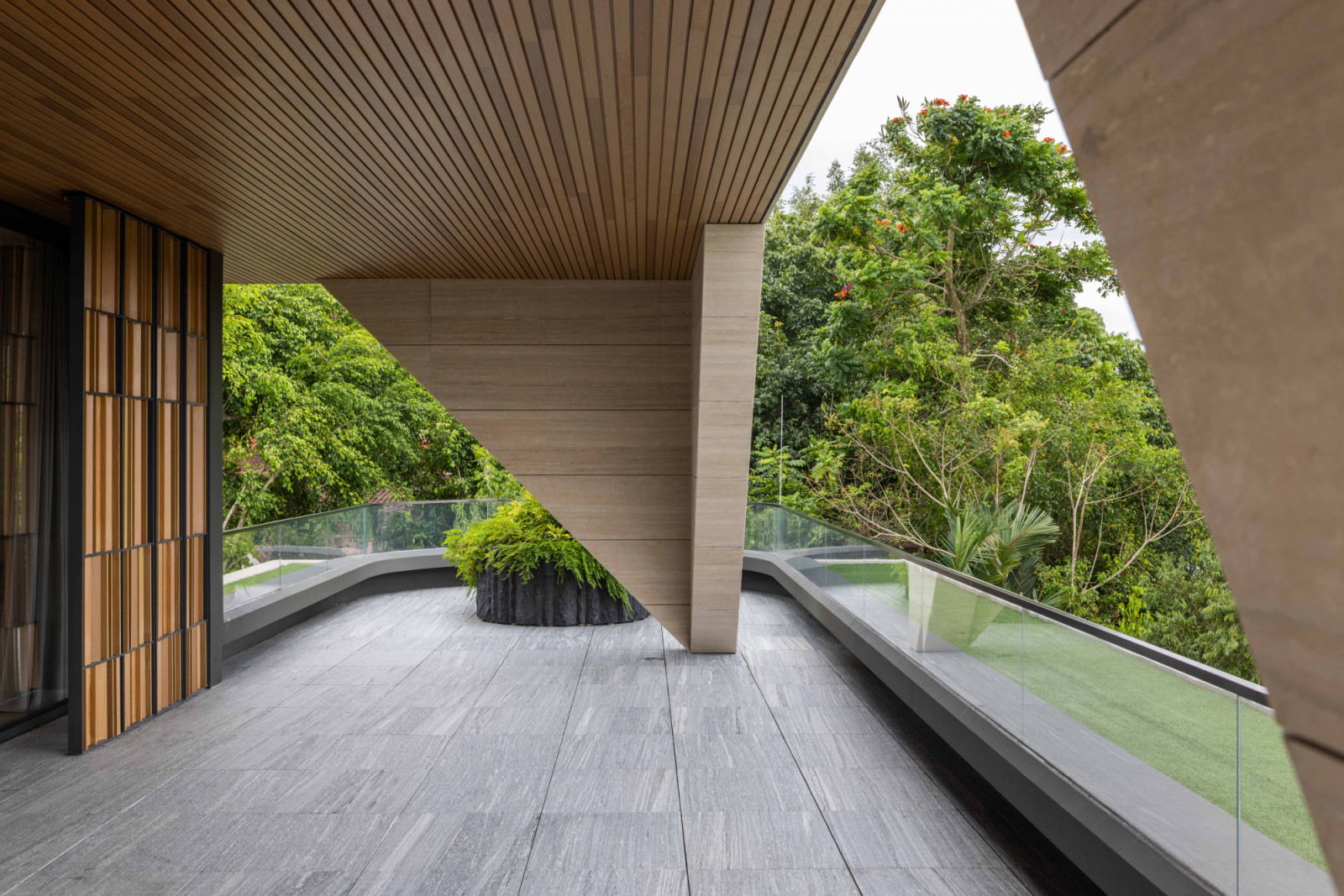 An architectural detail of the column reveals the precision and material finesse that define the good class bungalow’s design language