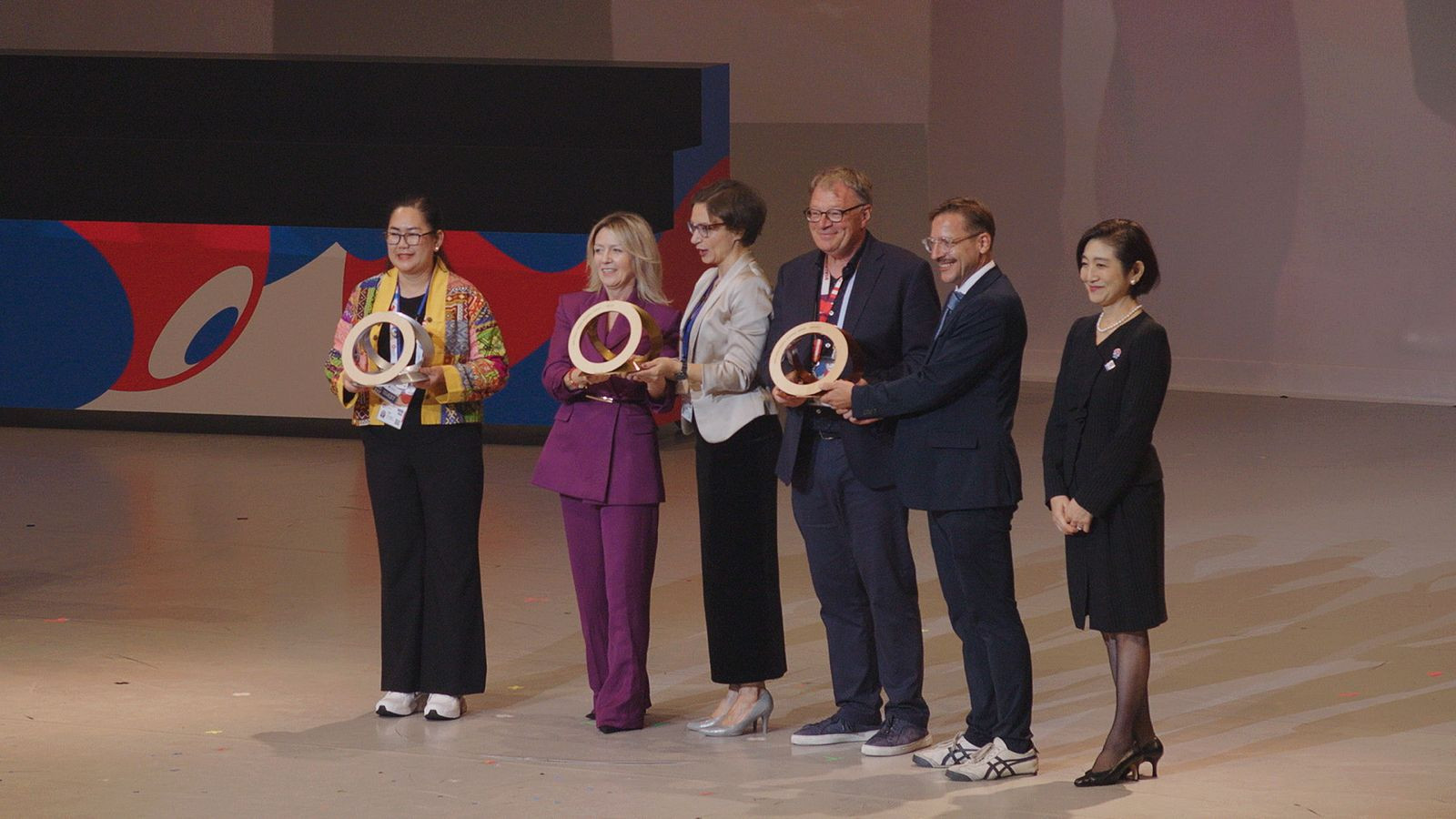 Philippine Pavilion committee head for central information Raquel Tria-Joya receives the Silver Award for Exhibition Design at the World Expo 2025 Osaka. Together with her on stage are representatives from Poland (gold) and Austria (bronze) (Photo: courtesy of TPB)