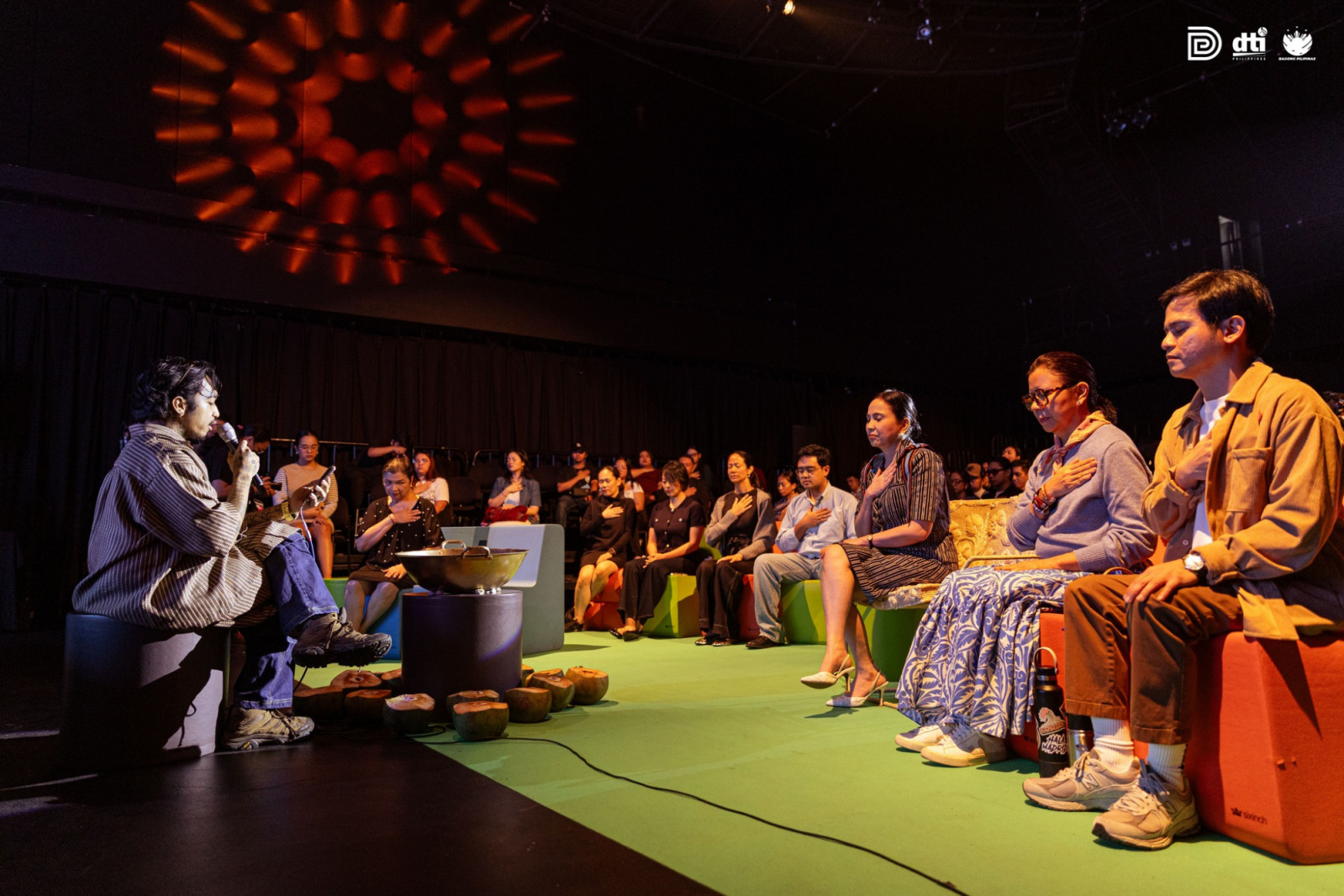Artist and illustrator Alaga leading the Design Week Philippines participants through an opening ceremony and meditation