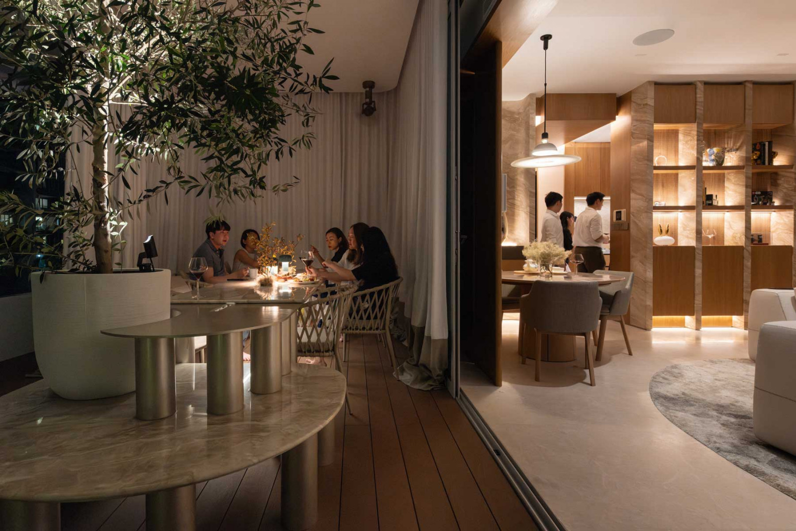 An outdoor dining area at Grange Infinite by Architology Interiors