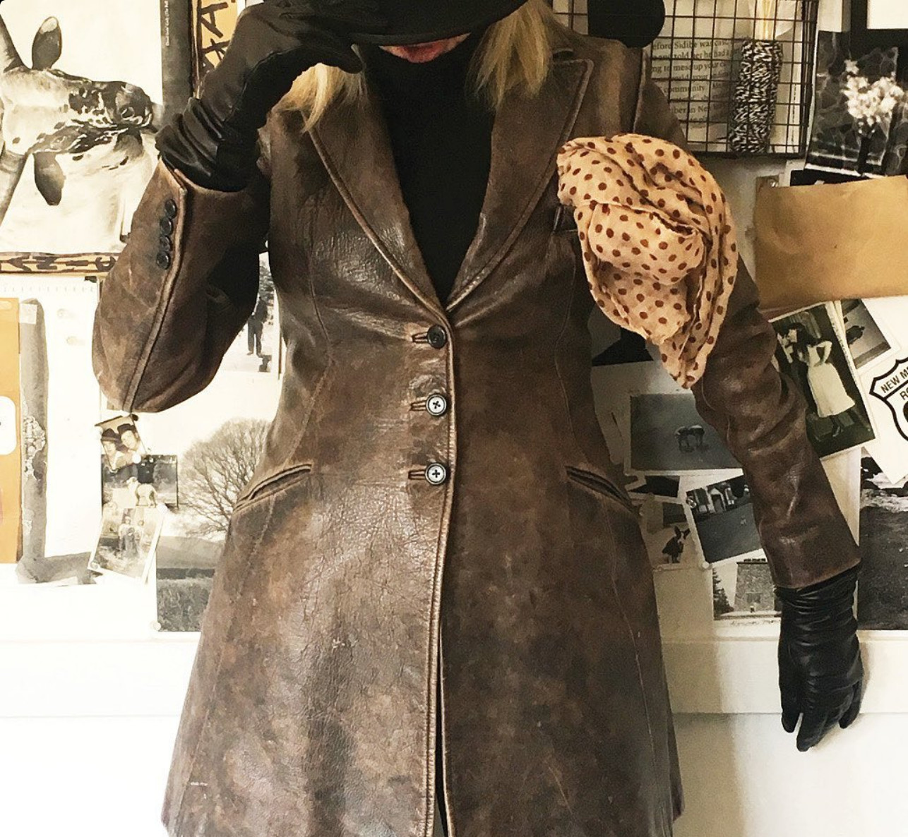 A weathered leather jacket layered with a polka dot scarf and black gloves (Photo: @diane_keaton / Instagram)