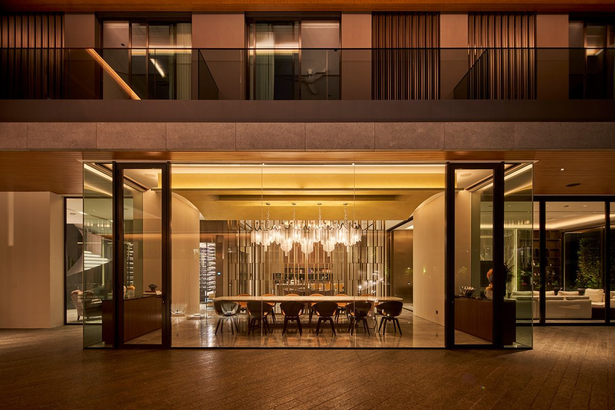 The opulent dining area features direct access to the outdoor spaces